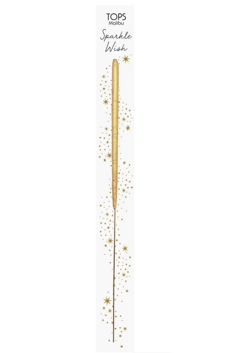 A single gold-colored sparkler stick, packaged vertically with sparkle accents around it, indicating it is a sparkler for celebrations.
