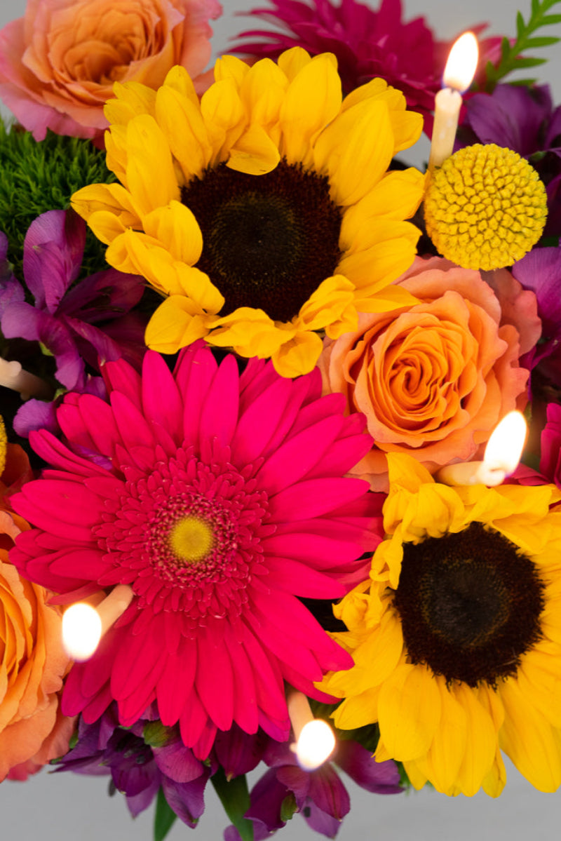 birthday candles and bright flowers to deliver for a fun birthday gift