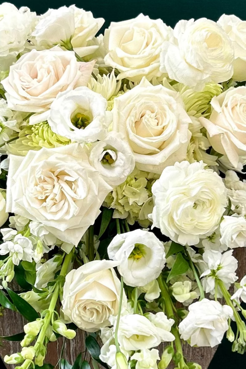 Large casket spray bouquet of white flowers for funeral or sypathy
