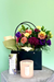 Glow & Bloom gift bundle with cheerful bouquet, candle, and hand cream in black handled gift bag