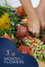 An assortment of colorful flowers and foliage arranged by a person's hands, with a promotional element indicating a '3 Month Flower Delivery' subscription.