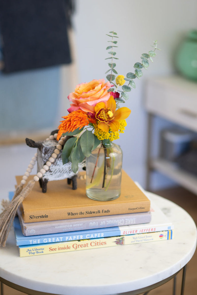 budvase with summer colored flowers