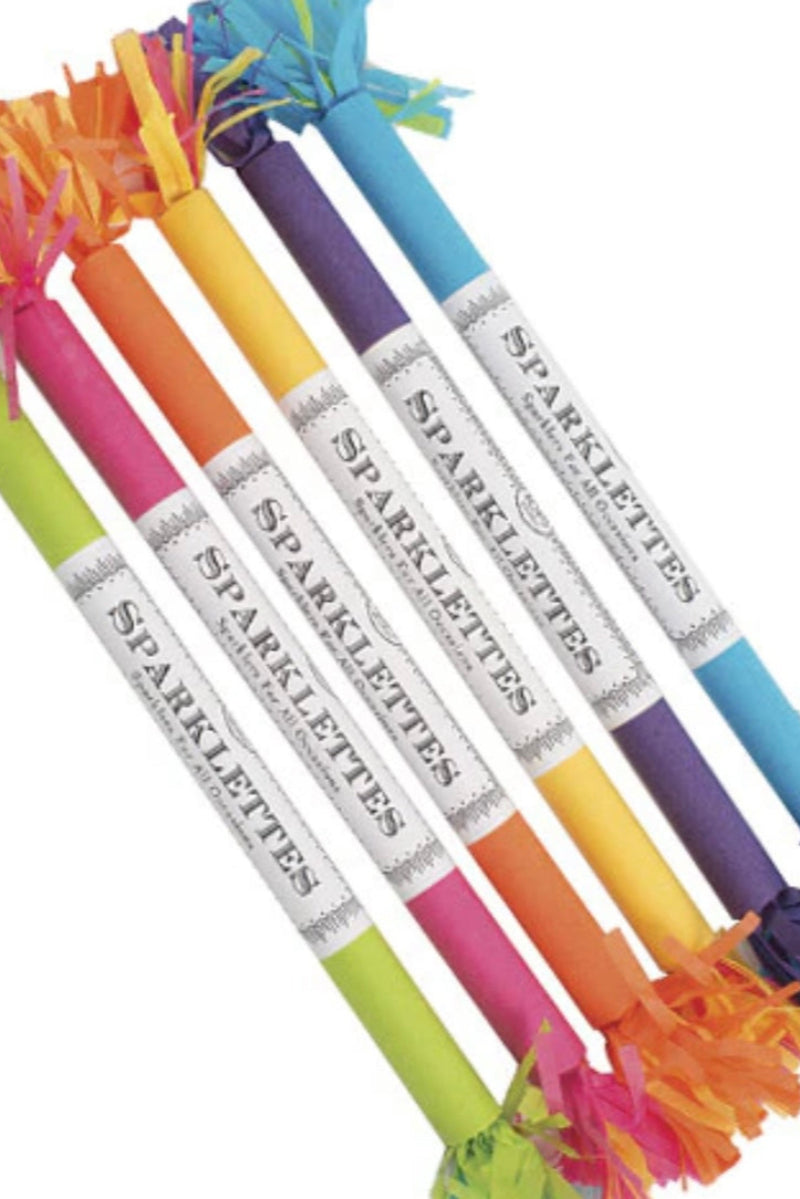 A set of colorful sparkle candles with vibrant decorative fringes, labeled 'Sparklettes' in a festive arrangement.
