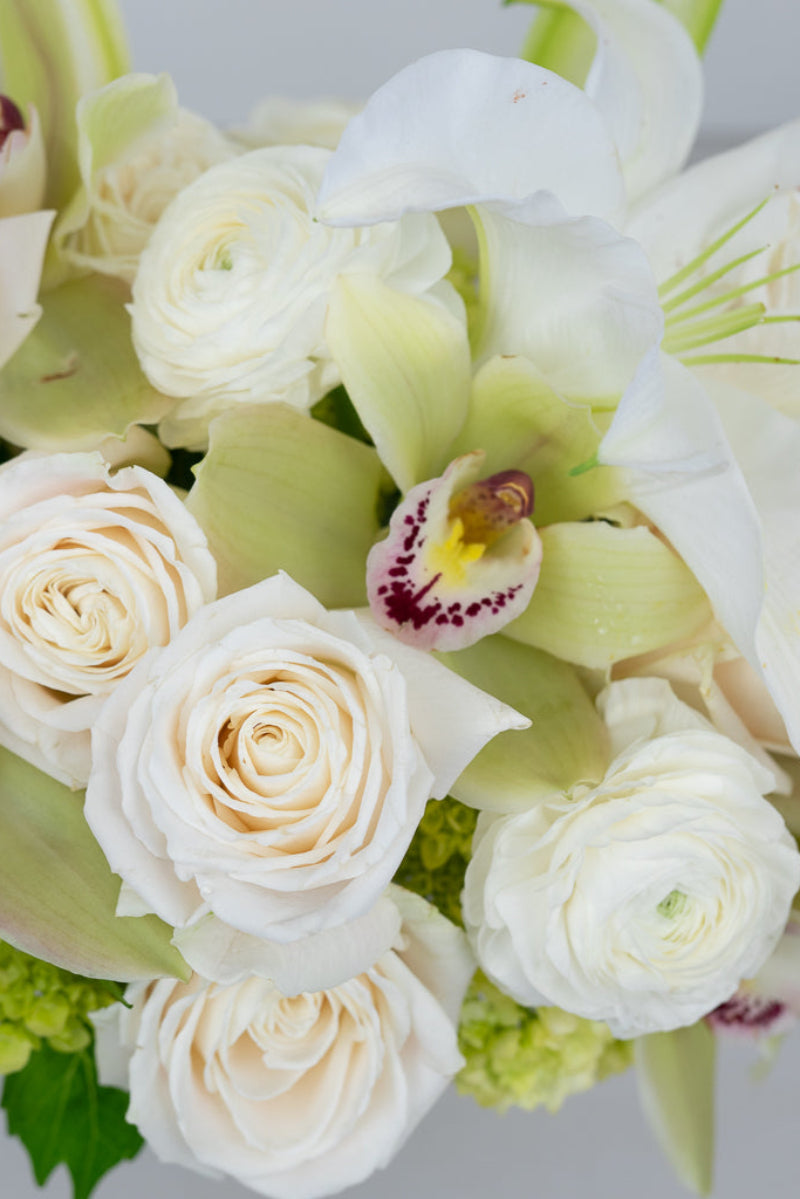 detail image of white and neutral flower bouquet perfect for funeral sympathy or loss gift giving