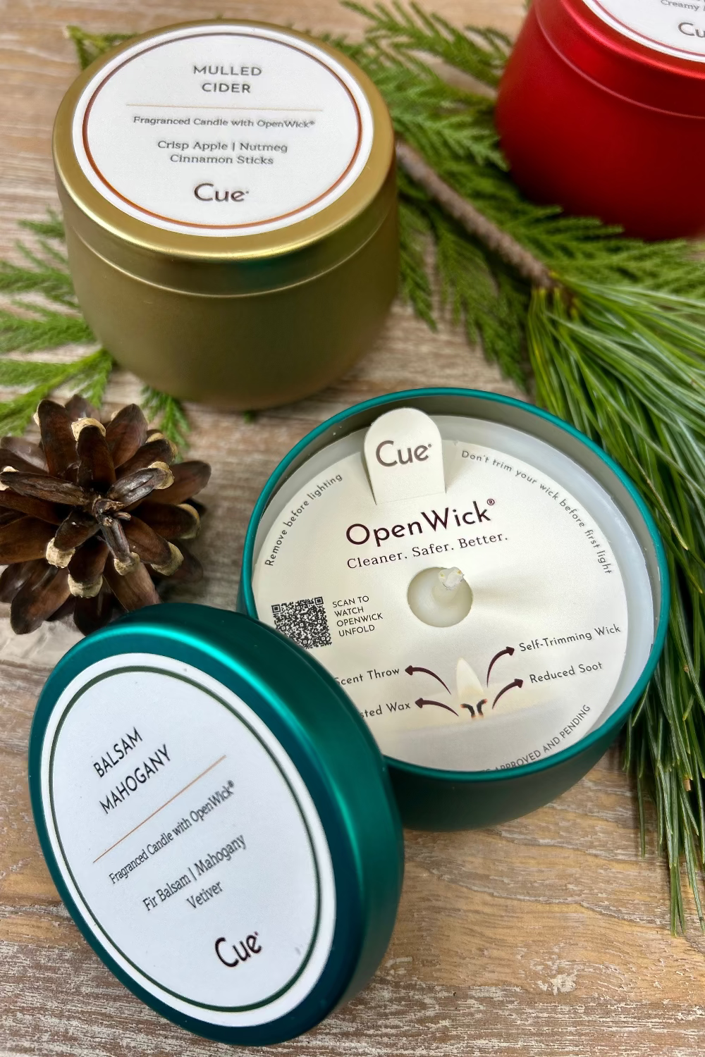 Close‑up of Cue Balsam Candle Gift Set showing tin detail and OpenWick™ technology