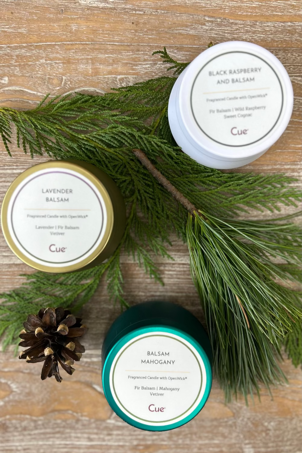 Trio of Cue candles from Balsam Candle Gift Set including Balsam Mahogany, Lavender Balsam, and Black Raspberry &amp; Balsam