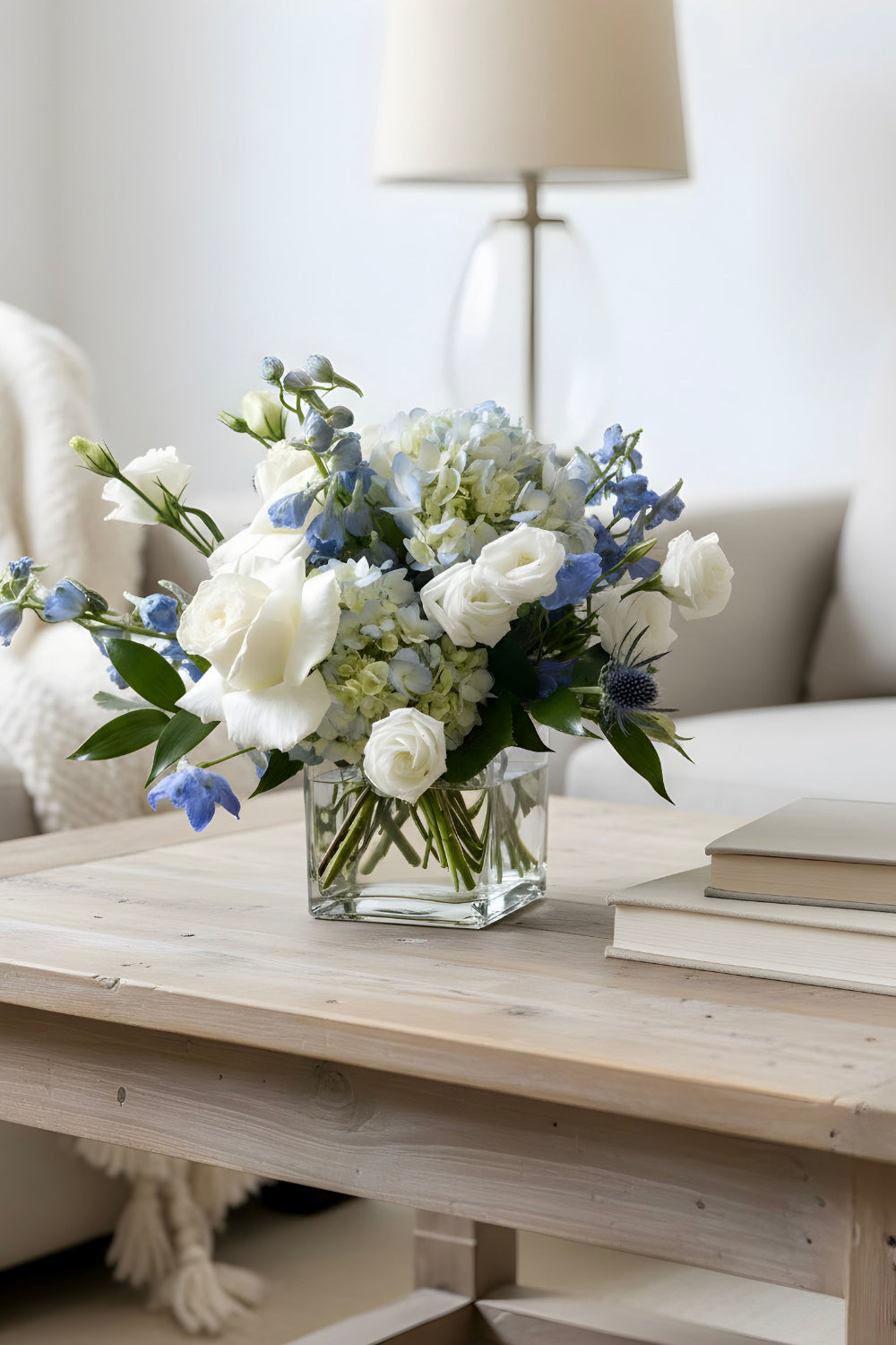 blue and white flower bouquet on coffee table