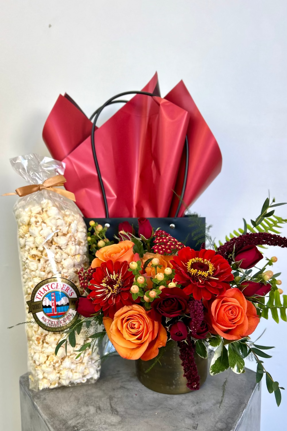 Crimson Crunch Gathering Set with fall bouquet of oranges, burgundies, reds, berries, and kettle corn from The Flower Fix