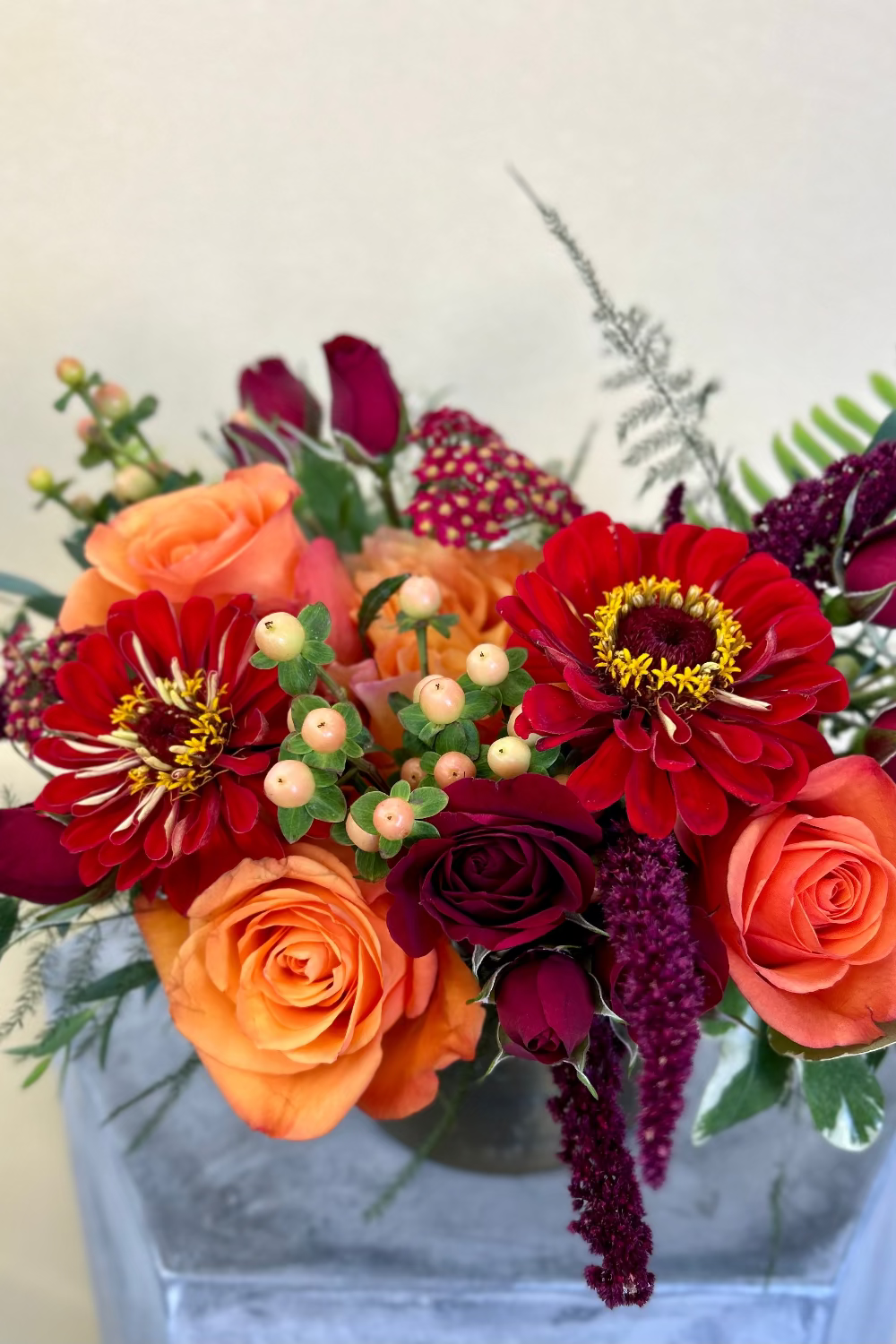 Crimson Gathering Bouquet styled on a dining table as a seasonal autumn centerpiece
