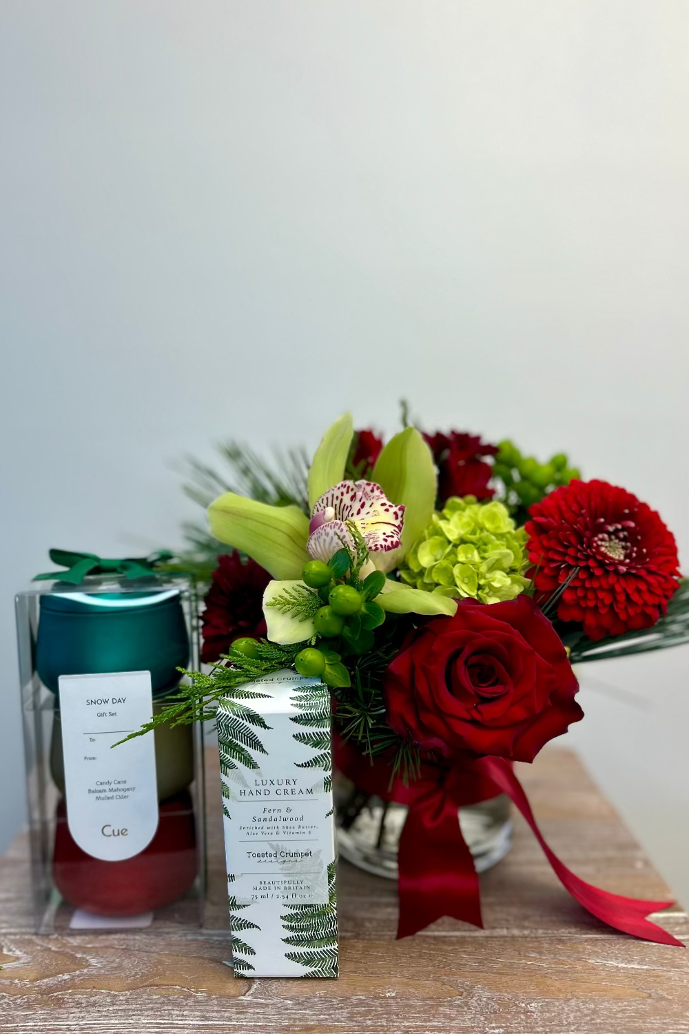 Holiday Harmony Gift Set with bouquet, candle trio, and hand crème