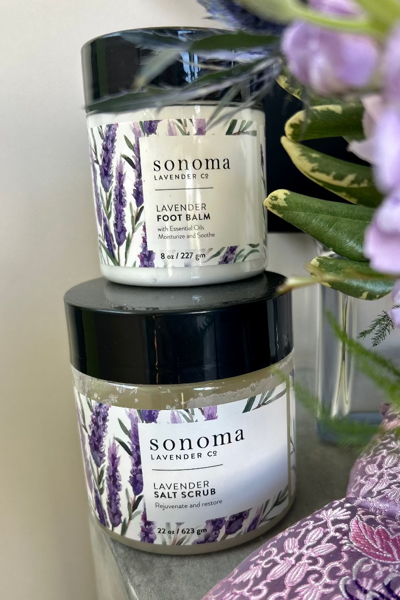 Lavender foot balm and lavender salt foot scrub in elegant packaging, part of Lavender Embrace gift set
