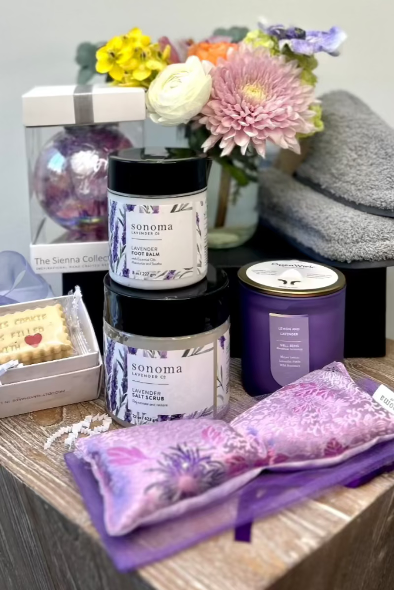 lavender-themed wellness gift set featuring flowers,spa essentials,and cozy treats-perfect for thoughtful giving.