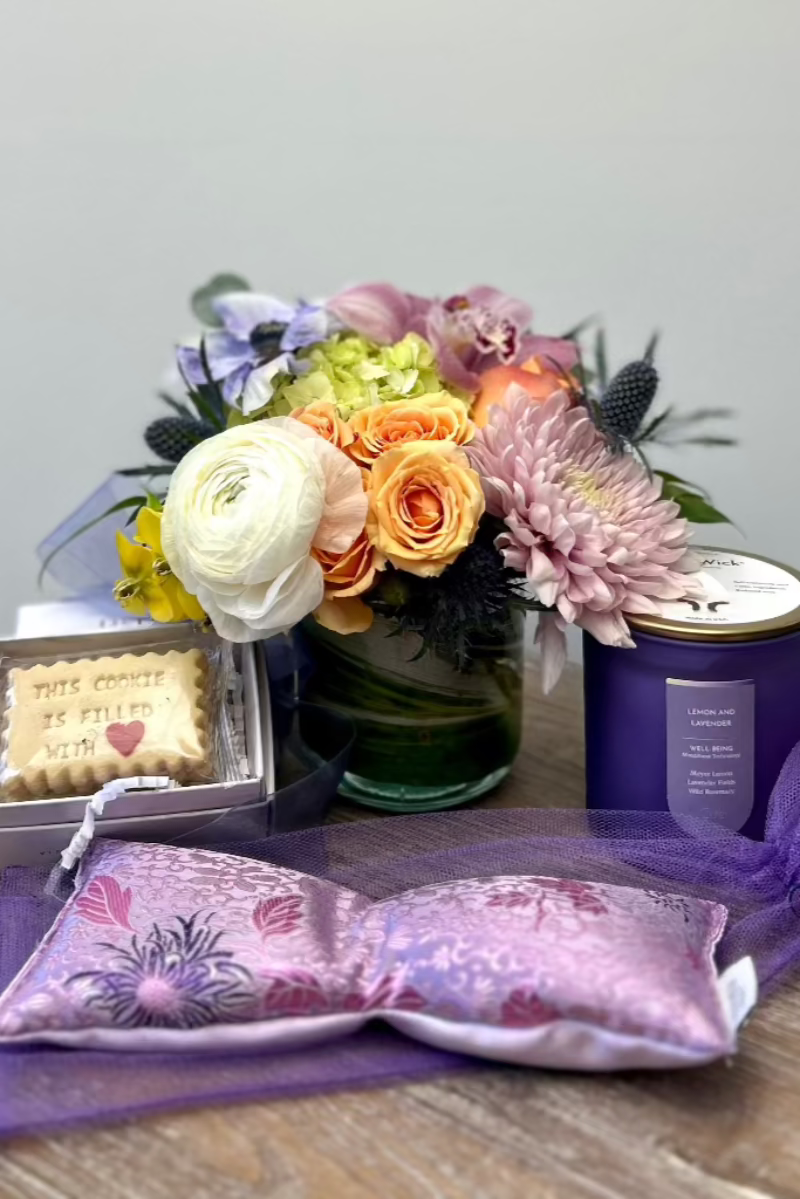 flower bouquet-lavender scented candle, eye mask, shortbread cookies-displayed for hand delivery in Castle Pines Colorado