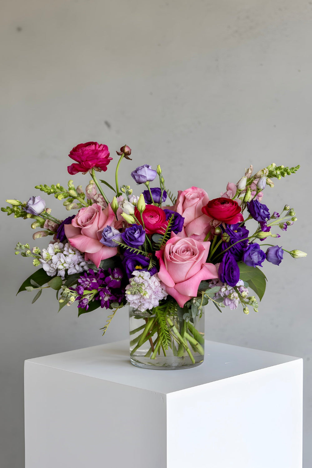 Purple and lavender flower arrangement with hot pink accents