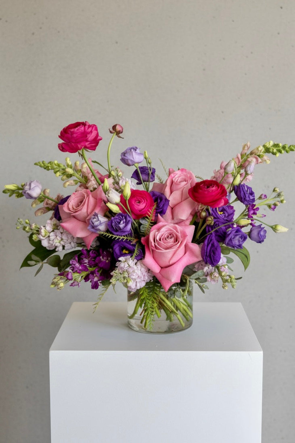 Lavender Muse purple bouquet with roses, ranunculus, snapdragons, and lisianthus