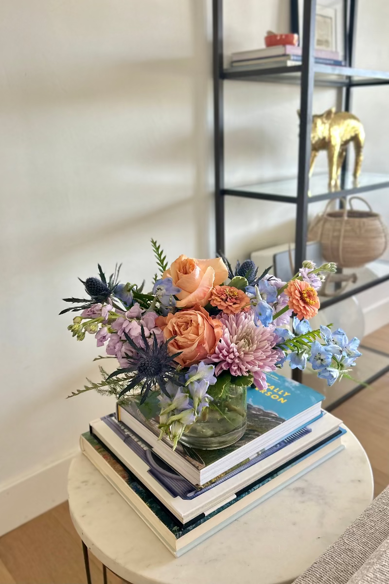 Morning Mist signature bouquet displayed on a table with natural light highlighting pastel tones and airy textures