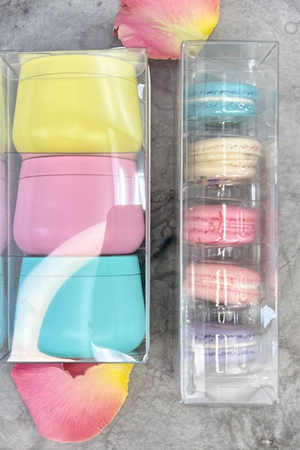 Colorful macarons and pastel candles in spring colors