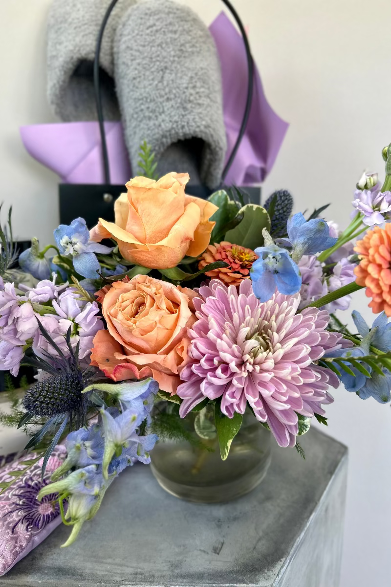 Petite hand-designed bouquet with fresh light blue, lavender, and blush flowers in The Flower Fix’s modern style