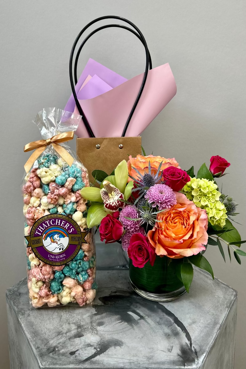 Pop & Petals gift set with petite Bloomfetti bouquet in bright colors and Thatcher’s Uni‑korn popcorn