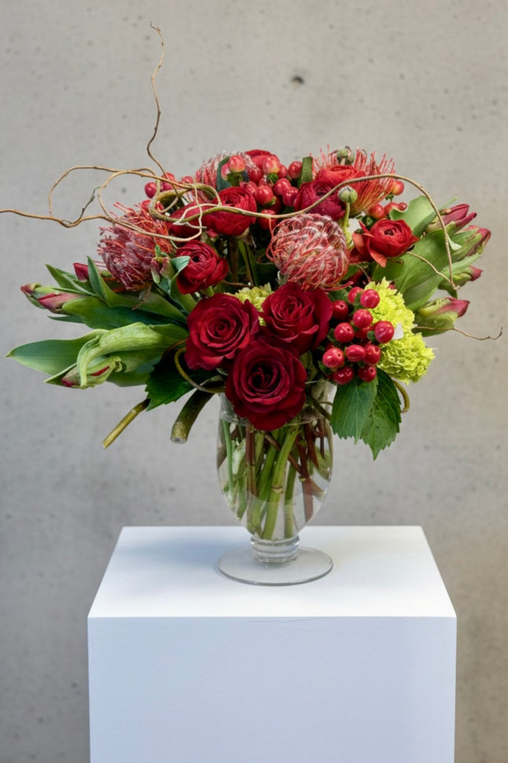 Custom modern flower arrangement created with seasonal blooms in chosen color palette