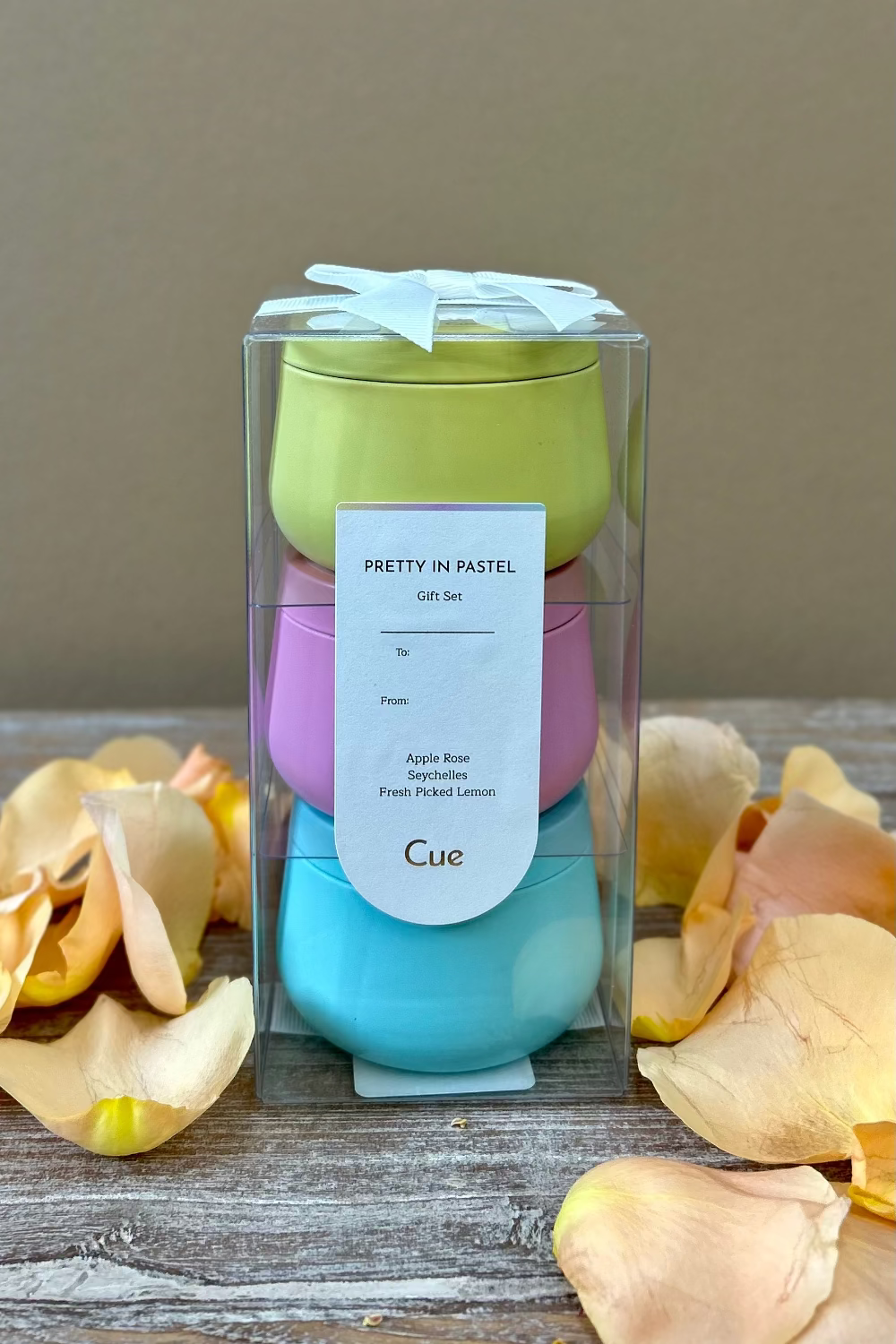 Pretty in Pastel Candle Gift Set by Cue with three 3.5oz tins featuring Apple Rose, Seychelles, and Fresh Picked Lemon