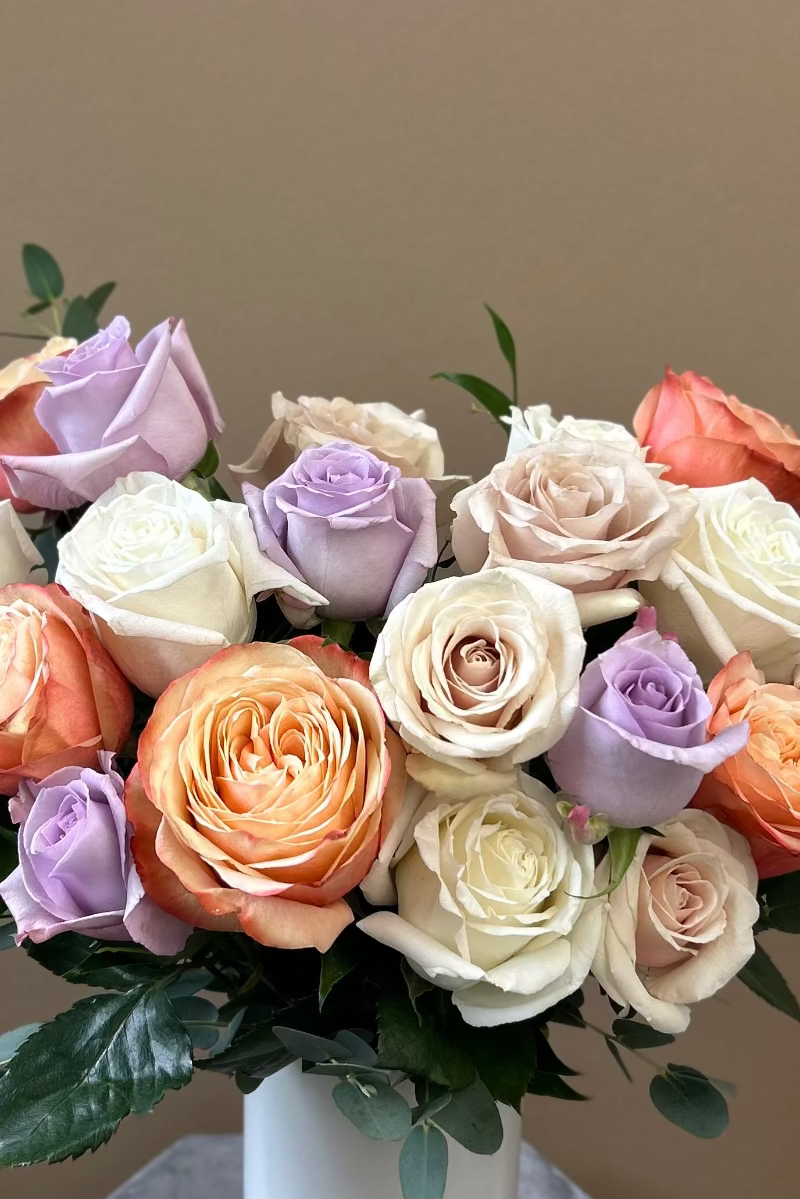 Petite Rose Crème bouquet featuring lavender, pink, white, and café latte roses offered for saturday and sunday delivery