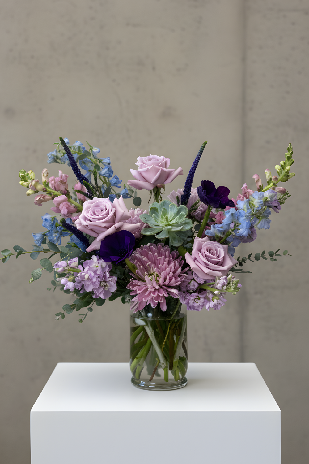 Classic Sanctuary Pastels bouquet featuring pastel roses, stock, and lisianthus in a full, airy spring arrangement.