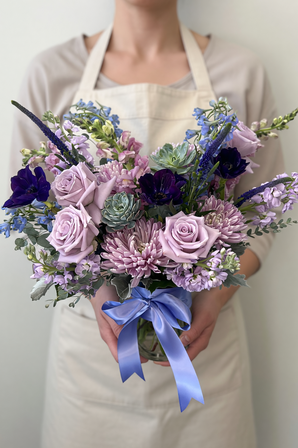 Premium Sanctuary Pastels bouquet with lush pastel blooms, added premium stems, held by Local florist in Castle Pines