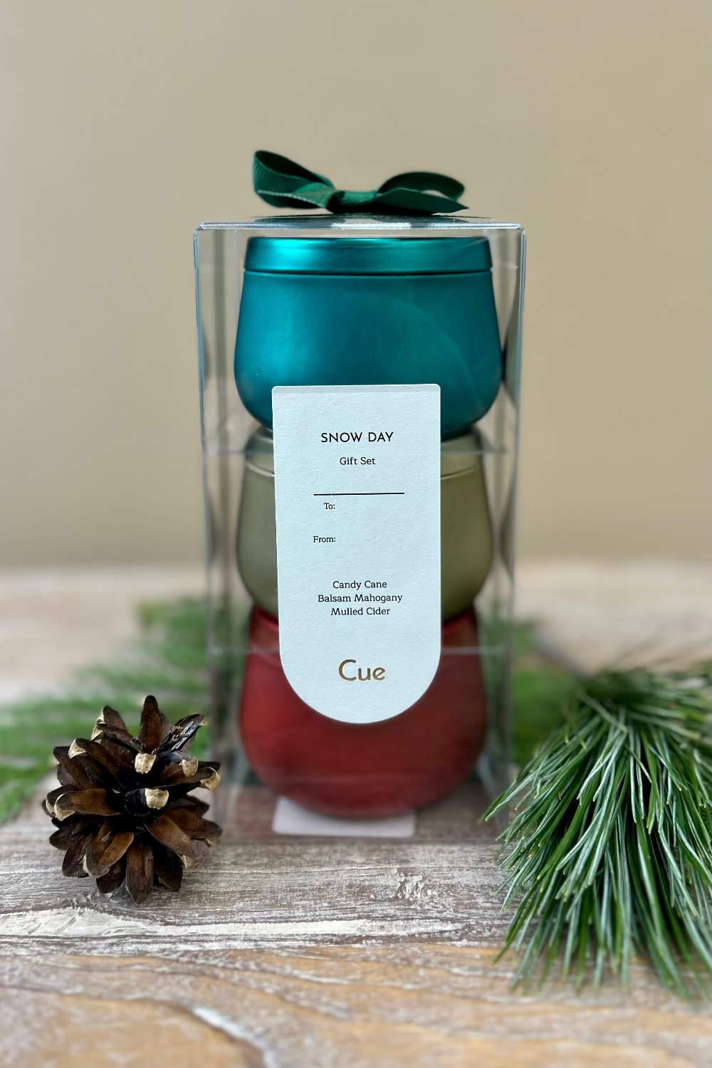 Snow Day Candle Gift Set by Cue with three 3.5oz tins featuring Balsam Mahogany, Spiced Cider, and Fresh Fallen Snow