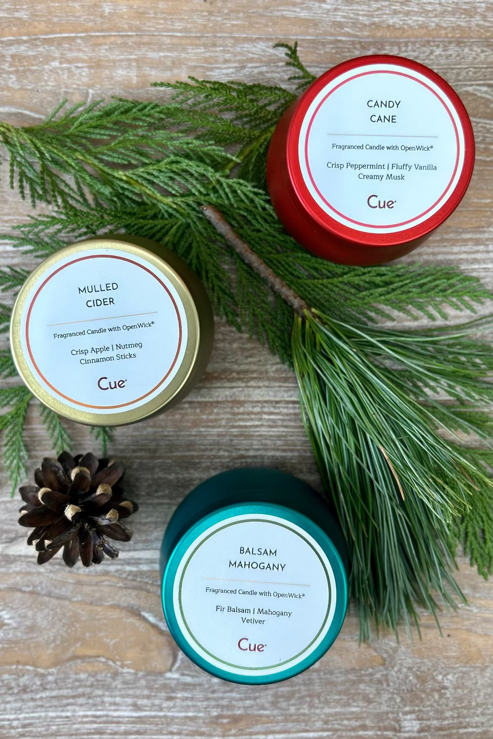 Trio of Cue candles from Snow Day Candle Gift Set including Balsam Mahogany, Spiced Cider, and Fresh Fallen Snow