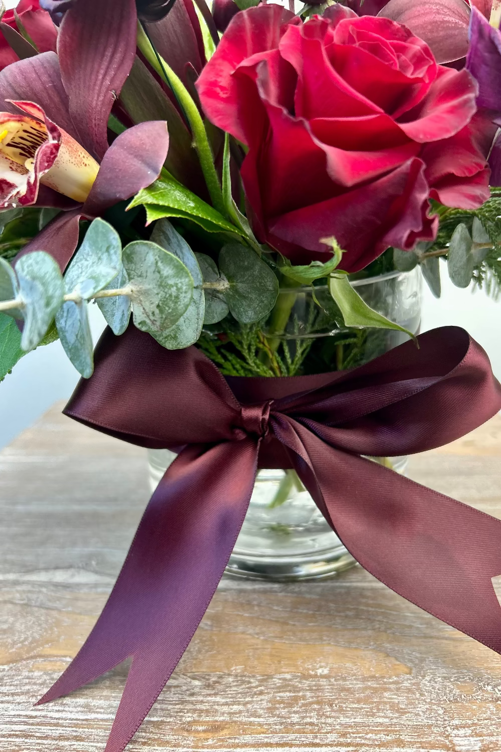 Sugar Plum Dreams bouquet wrapped in elegant winter packaging bow