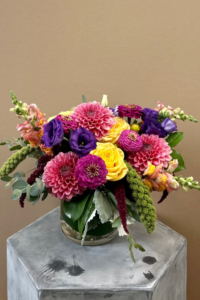 Garden Party Low bouquet with dahlias, zinnias, snapdragons, and millet in bright summer colors