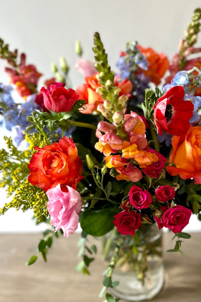 Colorful bouquet of seasonal summer flowers in a clear vase ready for birthday or instant party decor delivery in lone tree Colorado 