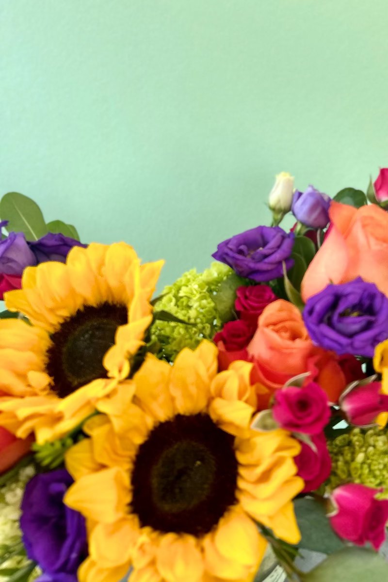 Hand-delivered bright bouquet from woman-owned Castle Pines florist with reliable service