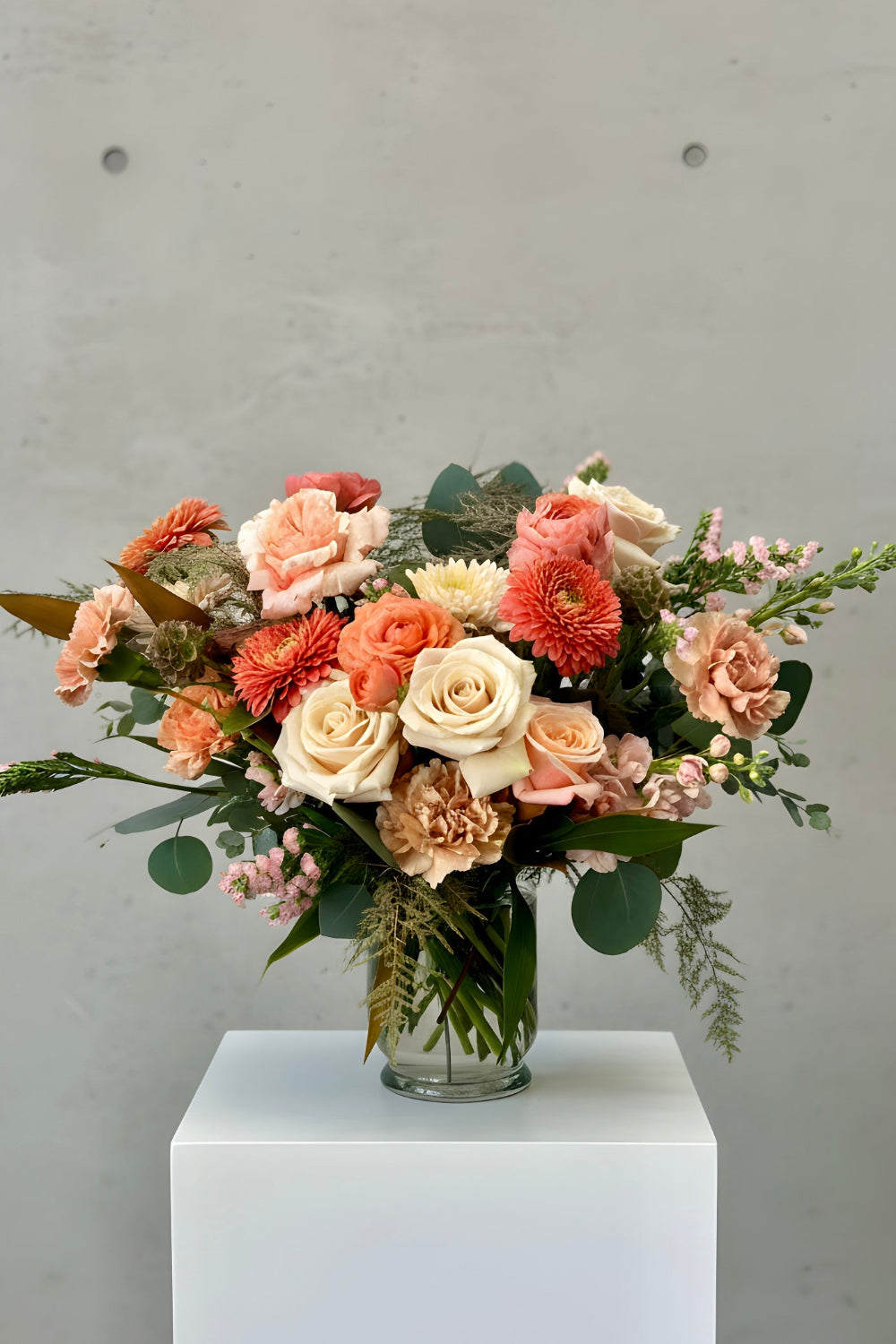 Classic Warm Embrace Mother’s Day arrangement with roses, ranunculus, and greenery