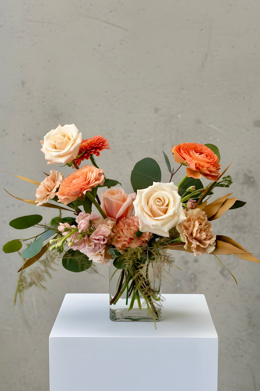 Petite Warm Embrace Mother’s Day bouquet with peach and coral flowers in a vase