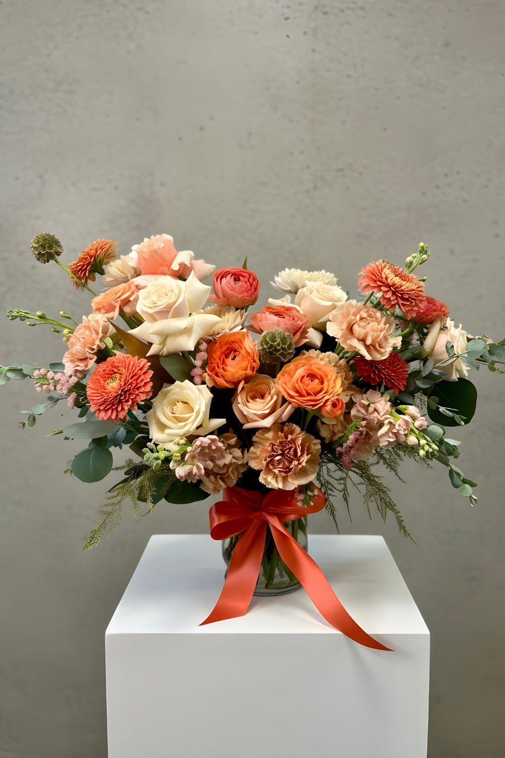 Premium Warm Embrace bouquet with luxury wrapping and satin ribbon