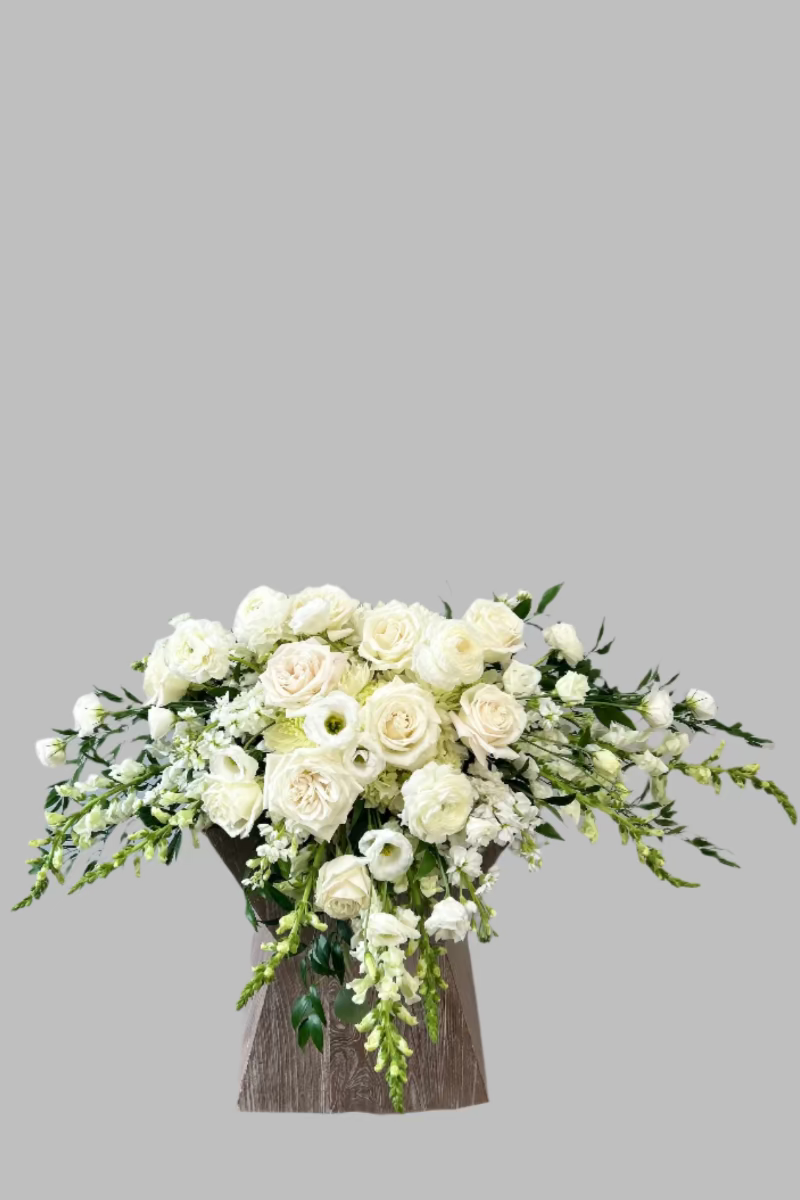 Casket spray Bouquet of white flowers for delivery in Castle Pines Colorado
