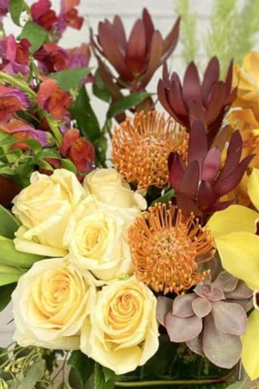 fall flower bouquet with mix of golds, burgundy, oranges