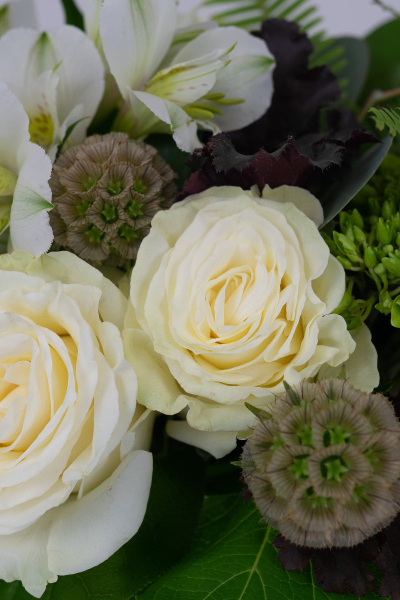 textural flowers in whites and neutrals for centerpiece