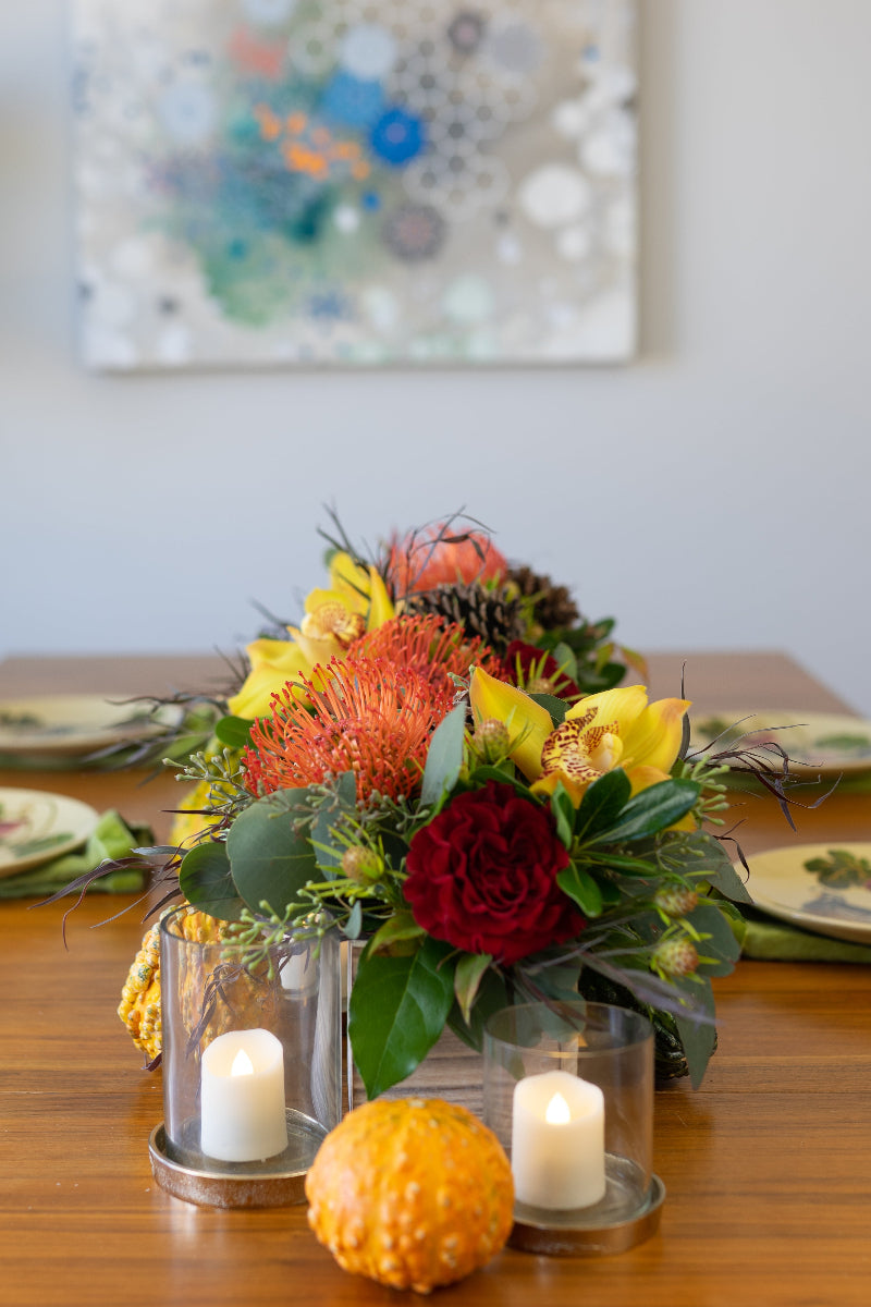 centerpiece with very textural premium flowers set for thanksgiving table