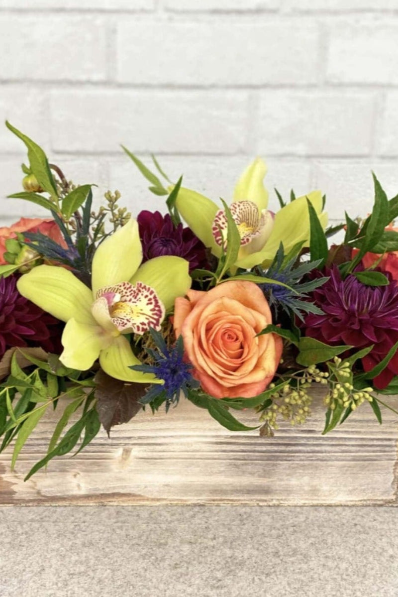 orchids, dahlias, thistle, roses, ecualyptus unique flower centerpiece