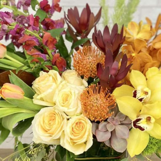 Thanksgiving centerpiece for delivery in  castle pines colorado with  roses, orchids, tulips, succulents
