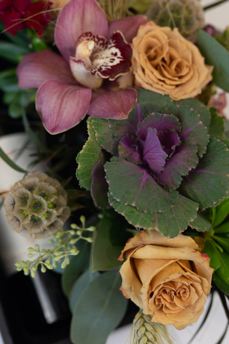 close up of wine and fresh flower centerpiece gift