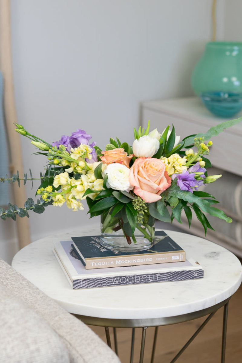  Pastel designer bouquet on dining table in soft and serene palette evokes warmth, softness, and elevated home décor