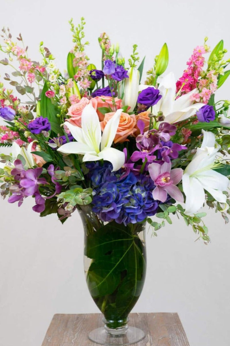 lilies, orchids, roses large flower bouquet suitable for funeral or large island